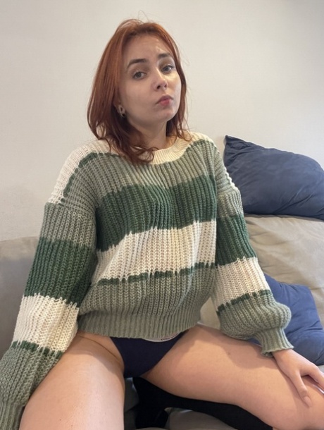Redheaded teen Viksy BB lifts up her sweater to show her small tits in a thong Pic 4